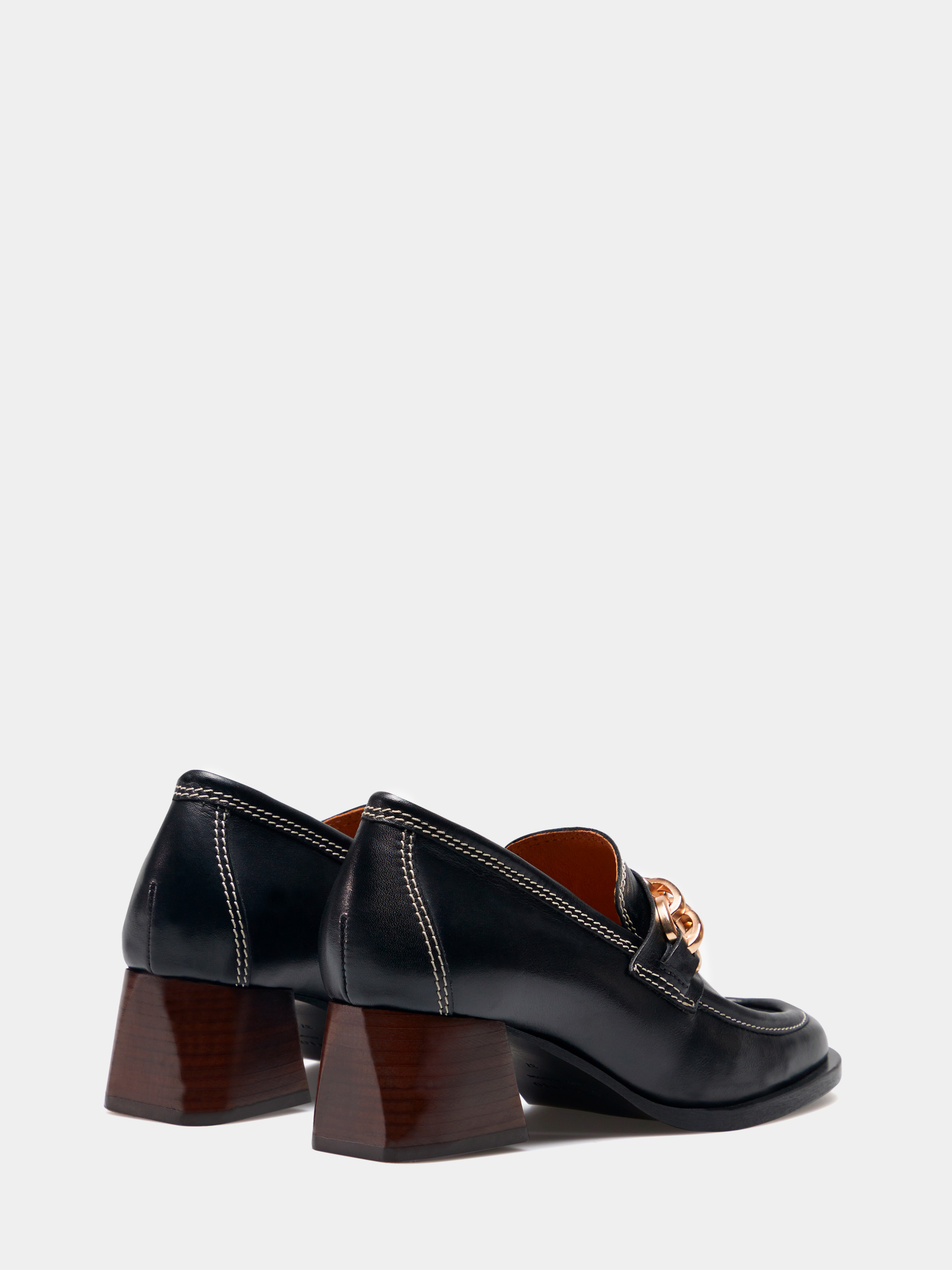 Moccasin with heel and metallic appliqué