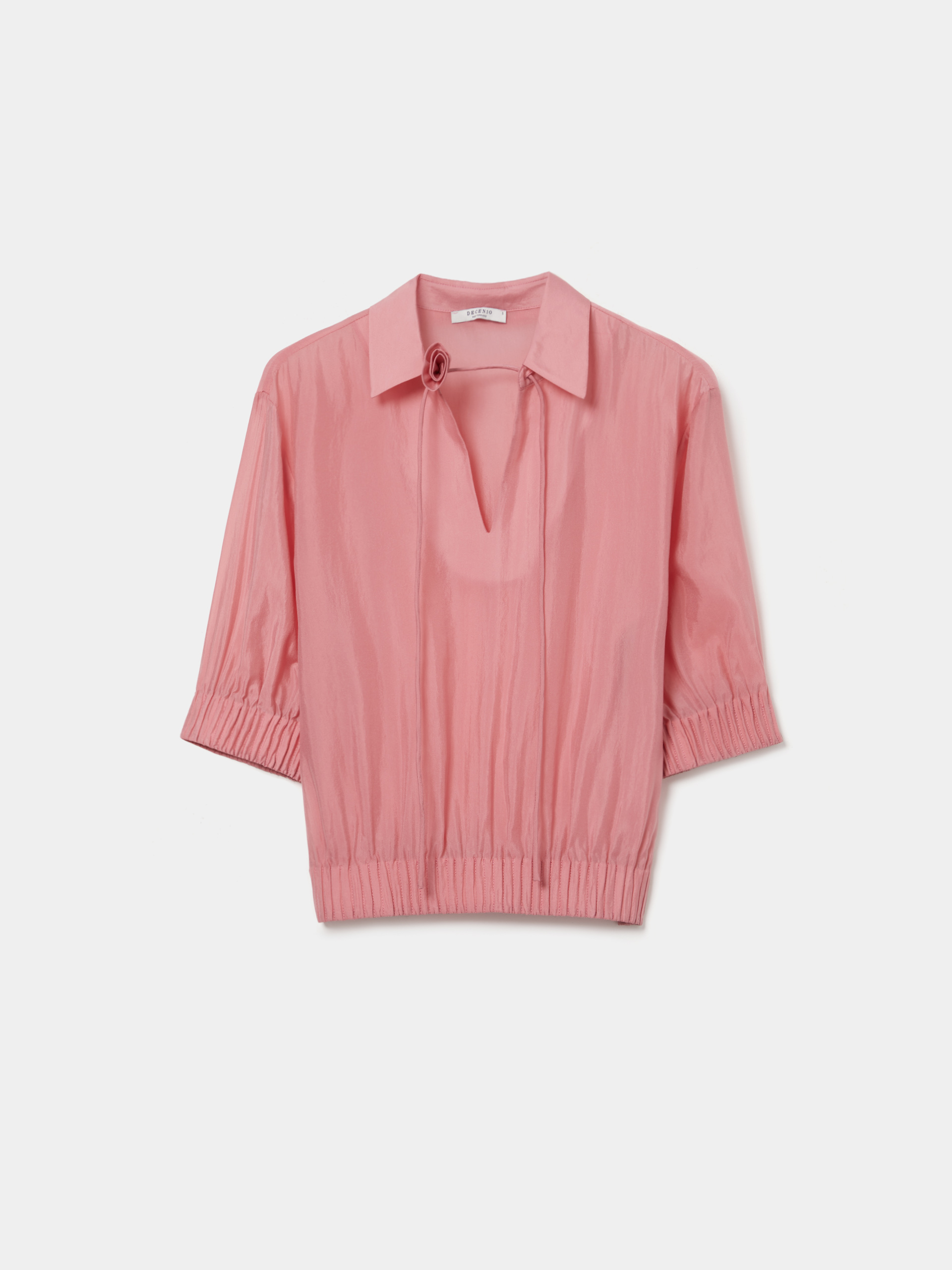 Flowy cupro blouse with flower detail.