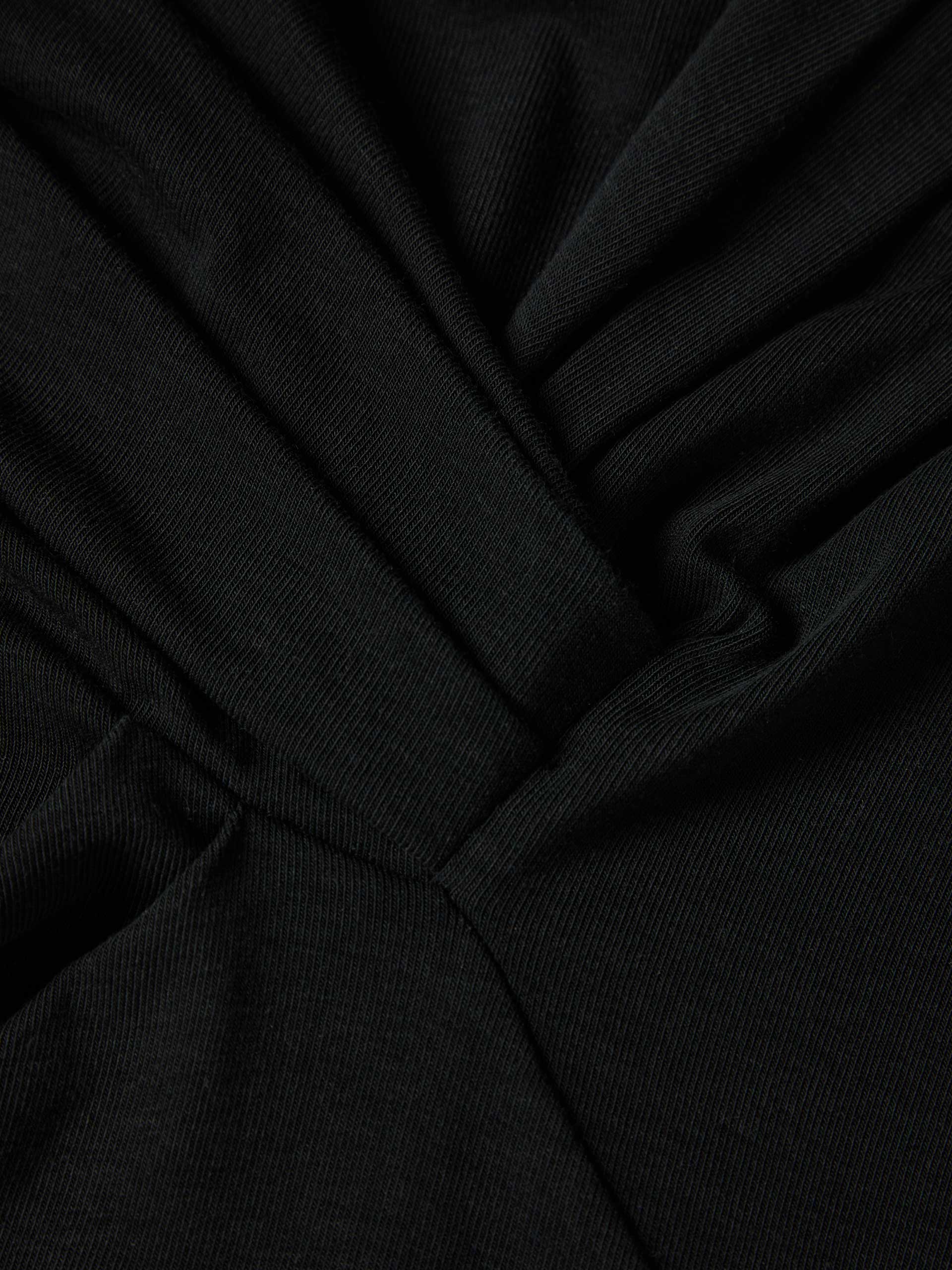 Sweater with asymmetrical neckline