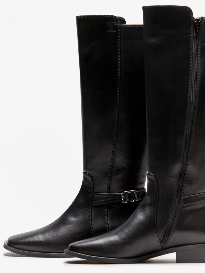 100% Leather high knee boots with a short heel