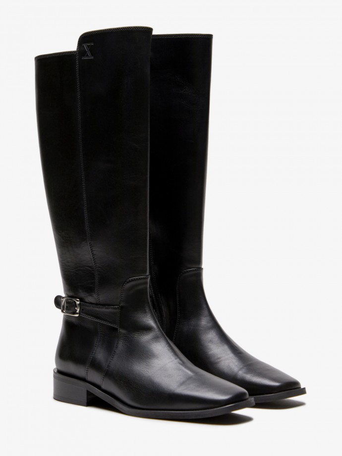 100% Leather high knee boots with a short heel