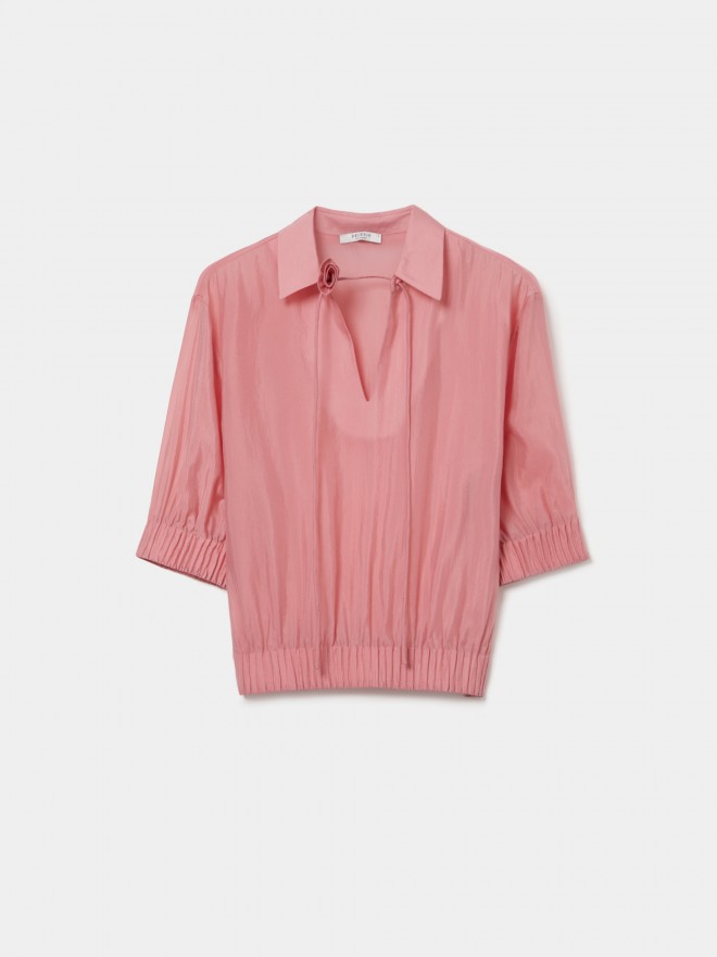 Flowy cupro blouse with flower detail. Flowy cupro blouse with flower detail.