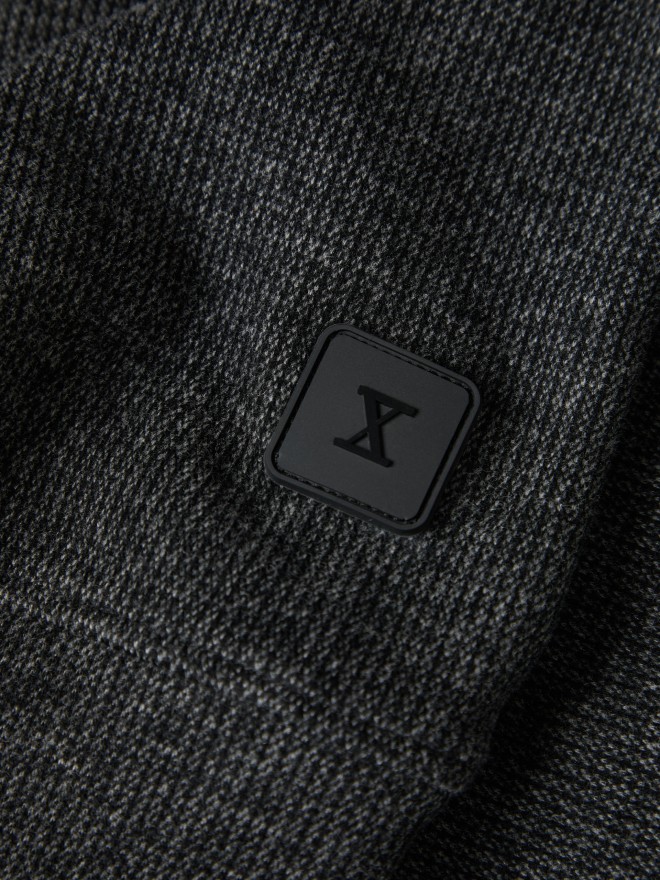 Two-tone sweater with half-zip closure