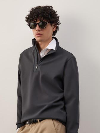 Sweater with half-zip closure