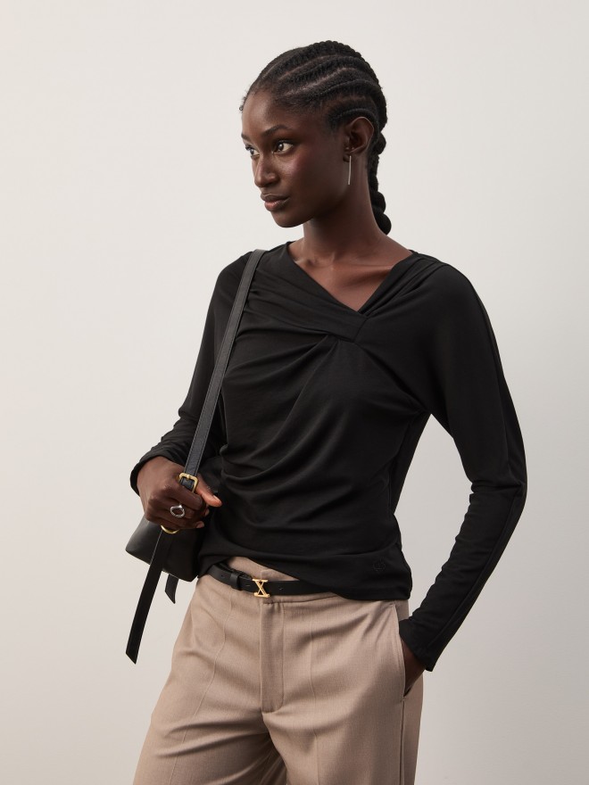Sweater with asymmetrical neckline