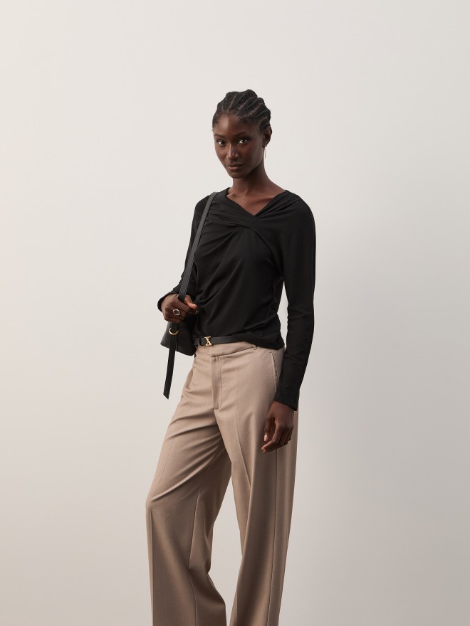 Sweater with asymmetrical neckline